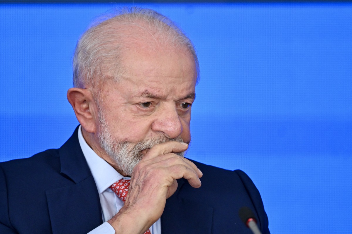 Brazil's President Luiz Inacio Lula da Silva gestures during a ceremony to announce investments in the defense industry at the Planalto Palace in Brasilia on February 12, 2025. (Photo by EVARISTO SA / AFP)