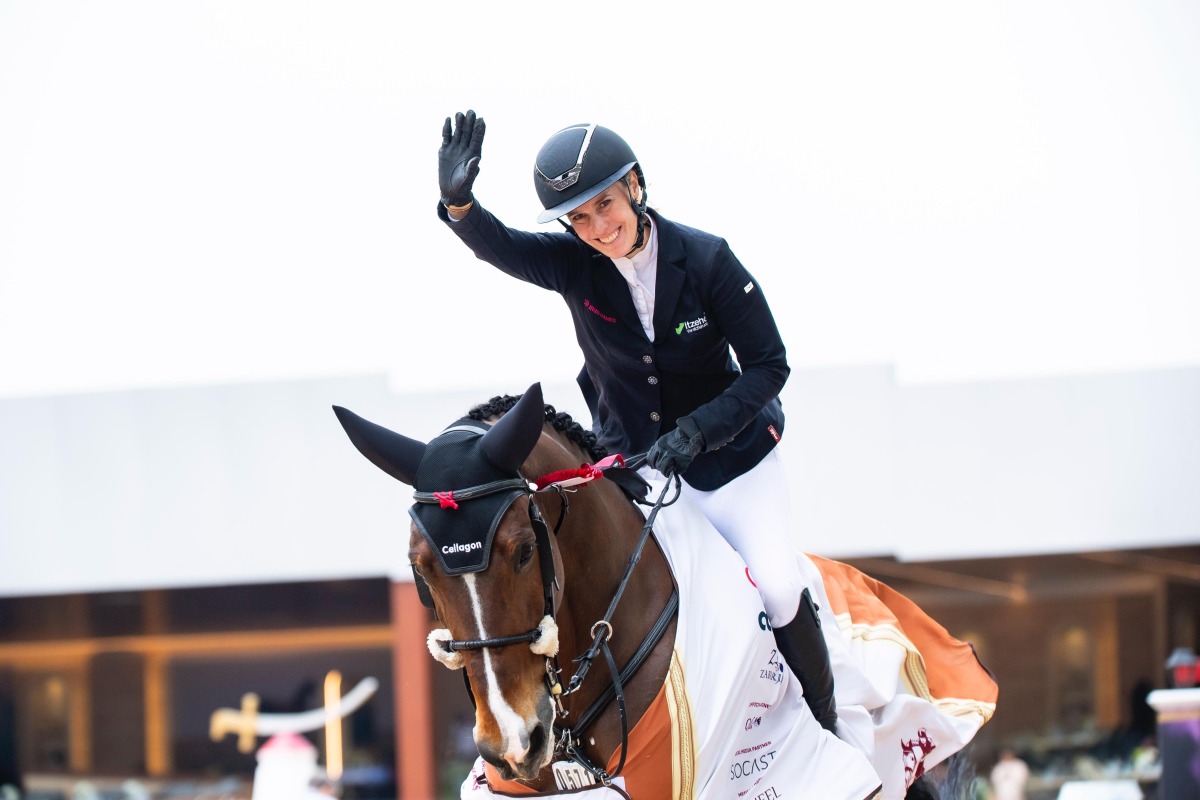 Germany’s Janne F. Meyer-Zimmermann celebrates her victory with Messi Van ‘T Ruytershof.