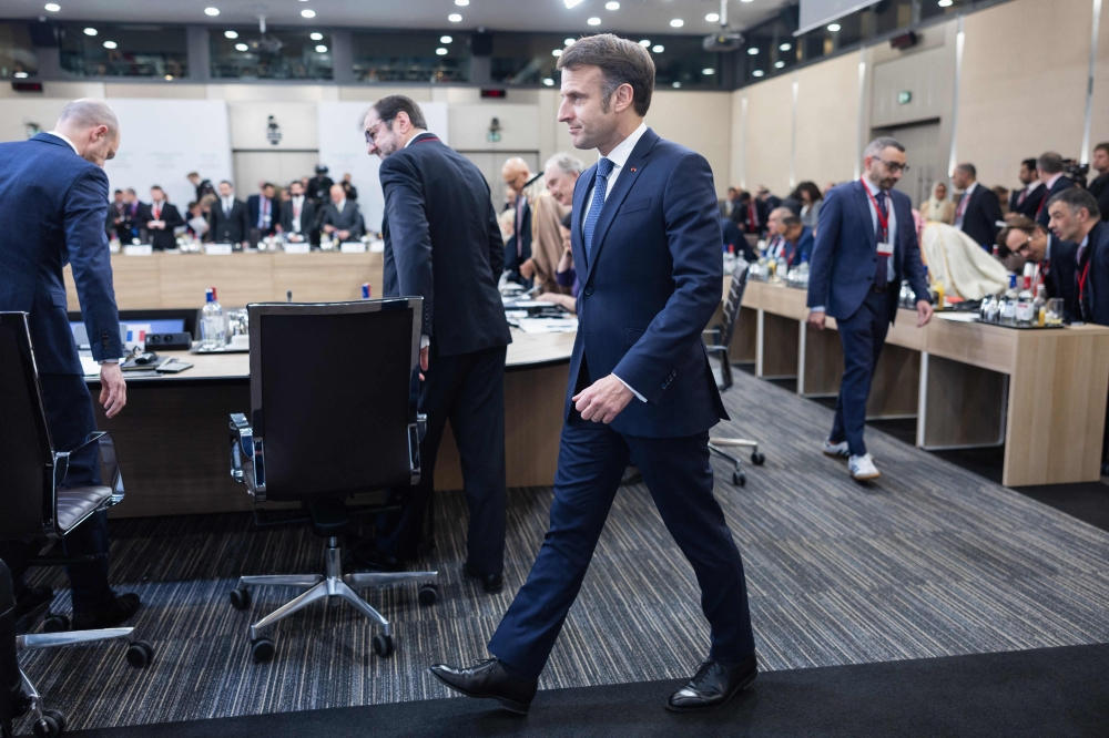 France's President Emmanuel Macron arrives for the International Conference on Syria at the Ministerial Conference Center, in Paris on February 13, 2025. (Photo by Sameer Al-Doumy / AFP)
