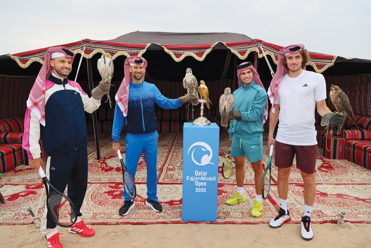 Grigor Dimitrov, Novak Djokovic, Carlos Alcaraz and Stefanos Tsitsipas pose for a photo with the Golden Falcon Trophy ahead of the Qatar ExxonMobil Open yesterday.