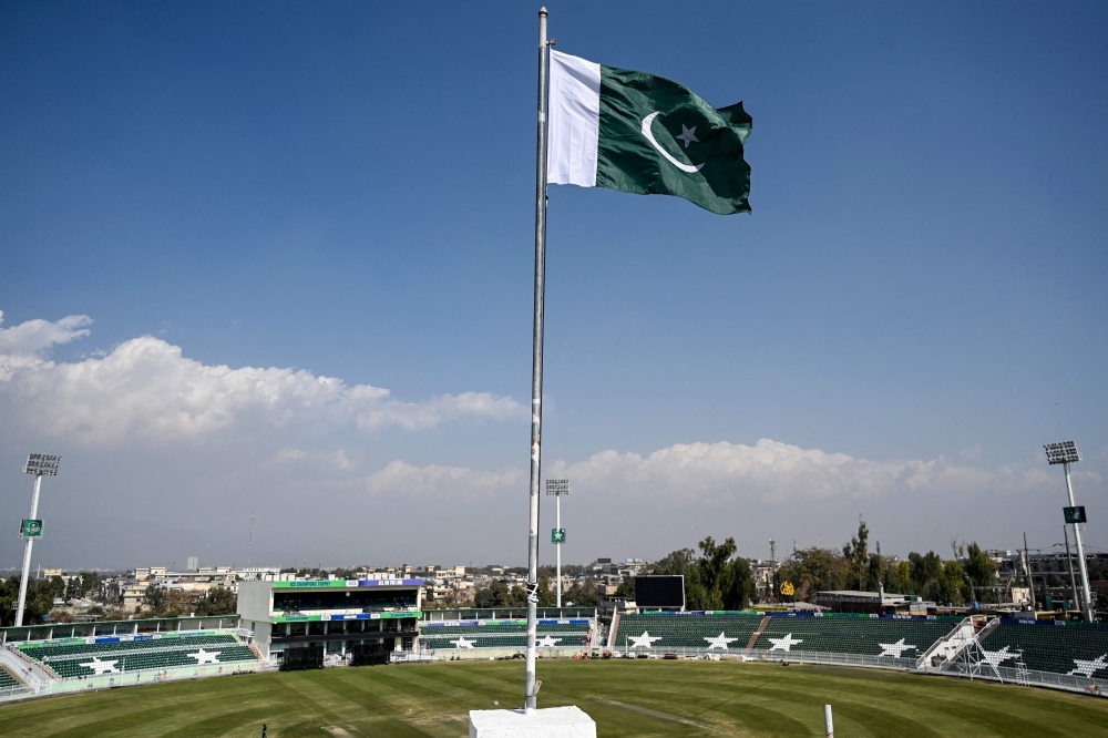 Pakistan's national flag flutters at the Rawalpindi Cricket Stadium ahead of the ICC Men's Champions Trophy one-day international (ODI) cricket matches in Rawalpindi on February 17, 2025. (Photo by Aamir Qureshi / AFP)