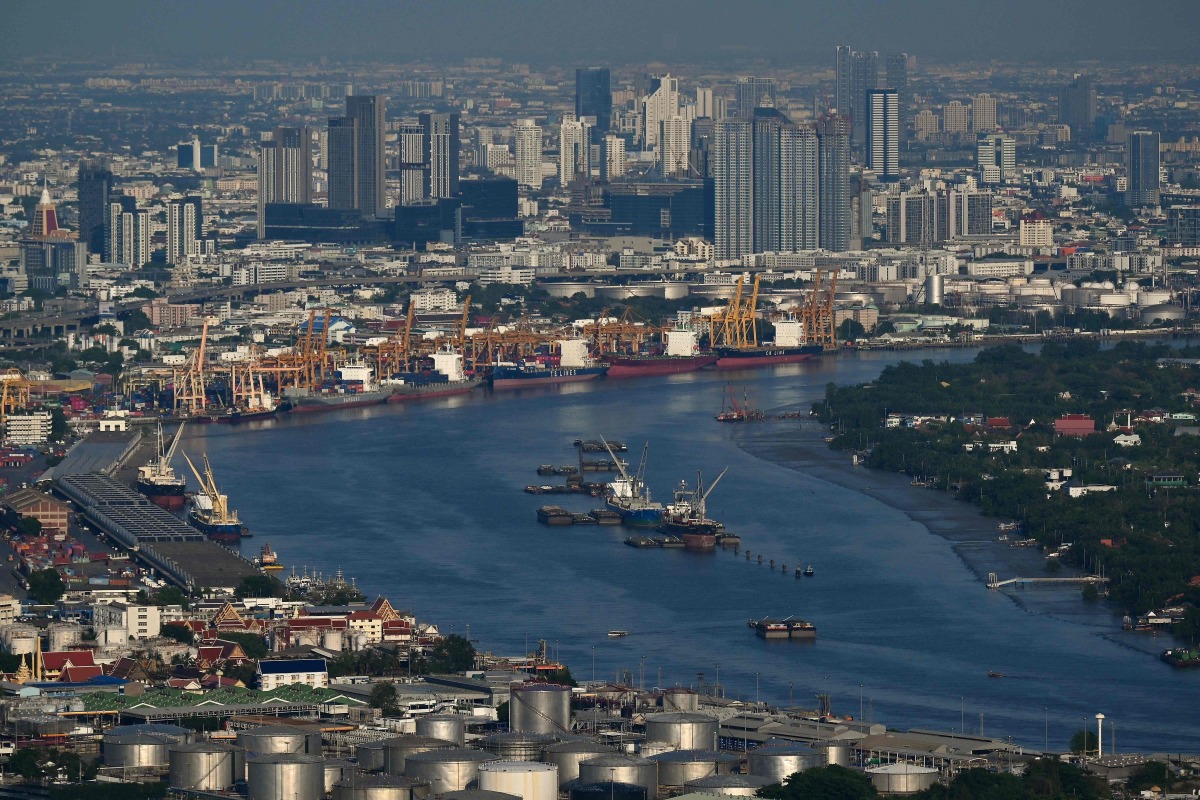 This photo taken on May 14, 2024 shows the skyline in the backdrop of the Bangkok Port as seen from the Mahanakhon Tower Observation deck in Bangkok. Photo by Lillian SUWANRUMPHA / AFP