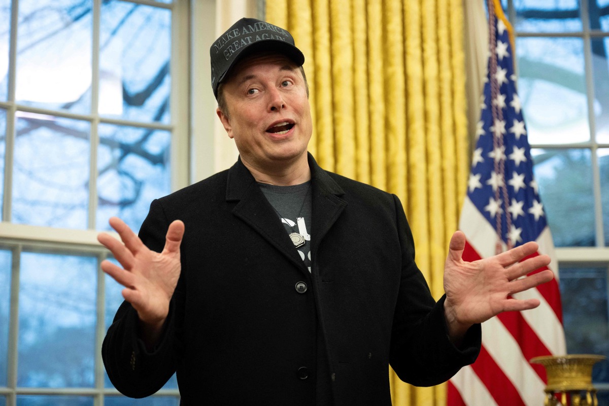 Elon Musk speaks in the Oval Office of the White House in Washington, DC, on February 11, 2025. Photo by Jim WATSON / AFP