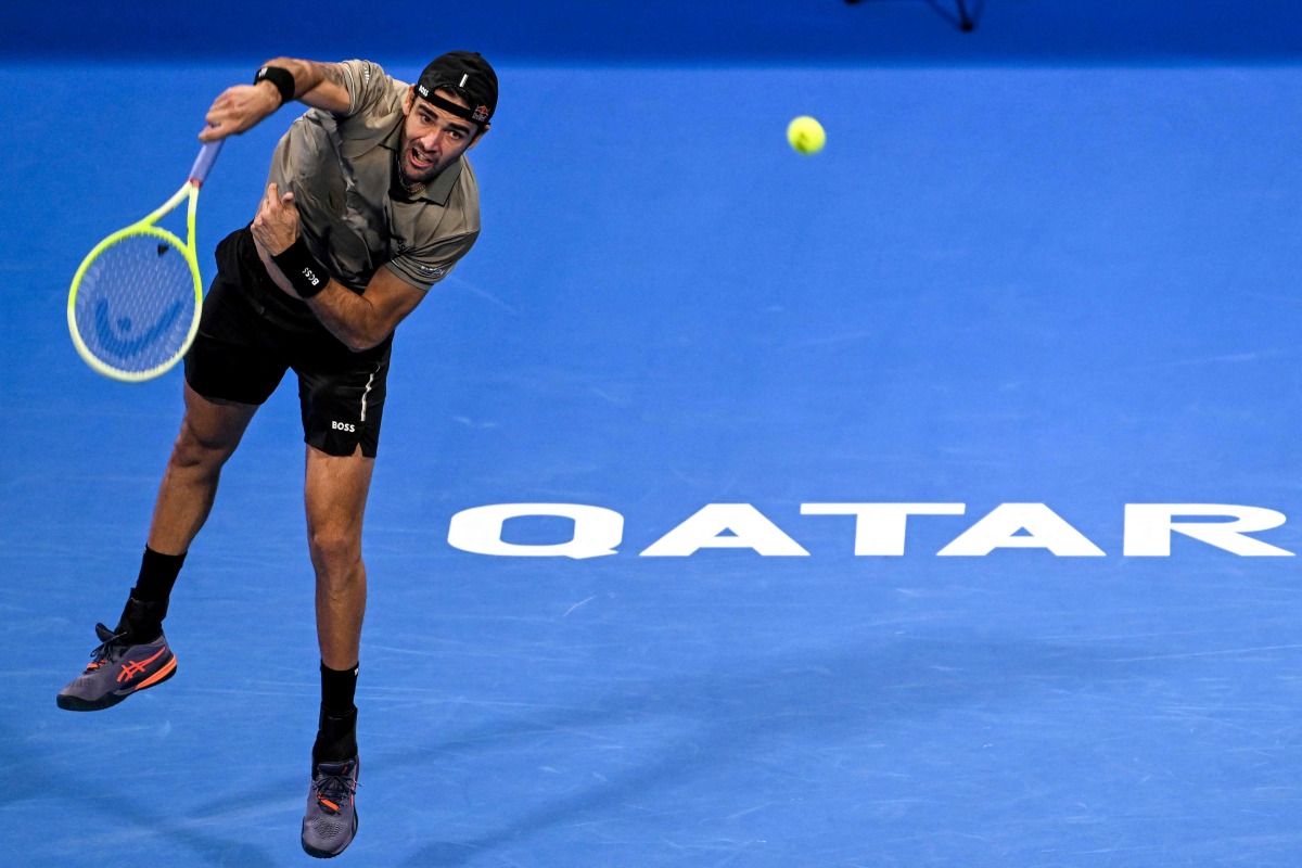 Italy’s Matteo Berettin serves against Serbia’s Novak Djokovic. AFP