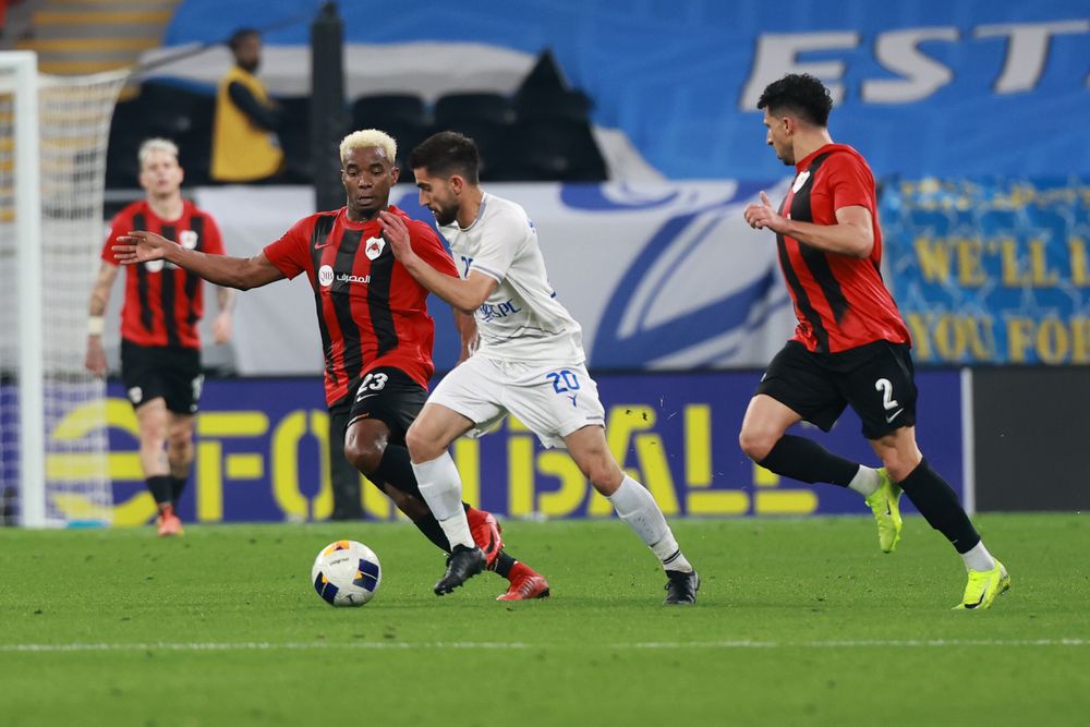 Action during the match between Al Rayyan and Esteghlal at Ahmad Bin Ali Stadium. 