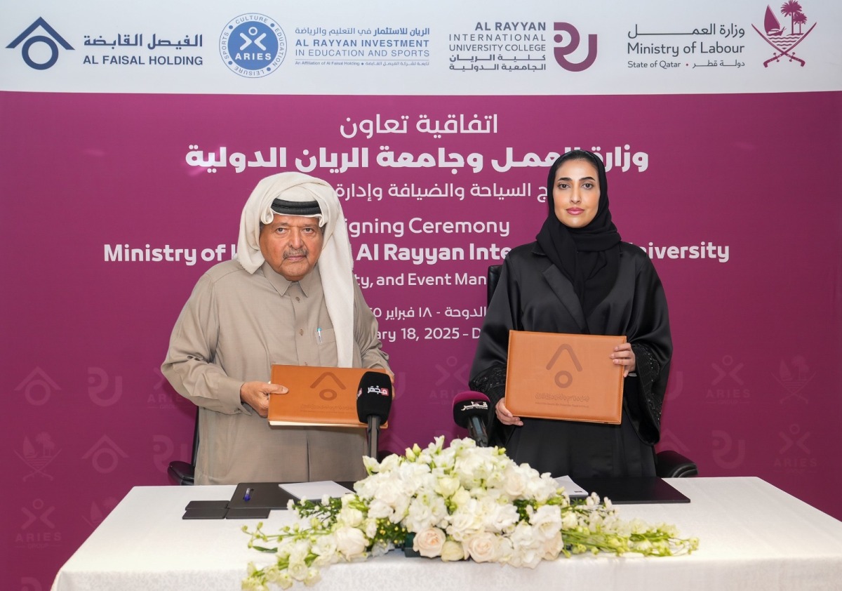 Shaikha Abdulrahman Al Badi, Undersecretary for National Manpower Affairs in the Private Sector and H E Sheikh Faisal bin Qassim Al Thani, Chairman of Al Faisal Holding Group exchanging documents after signing the agreement.