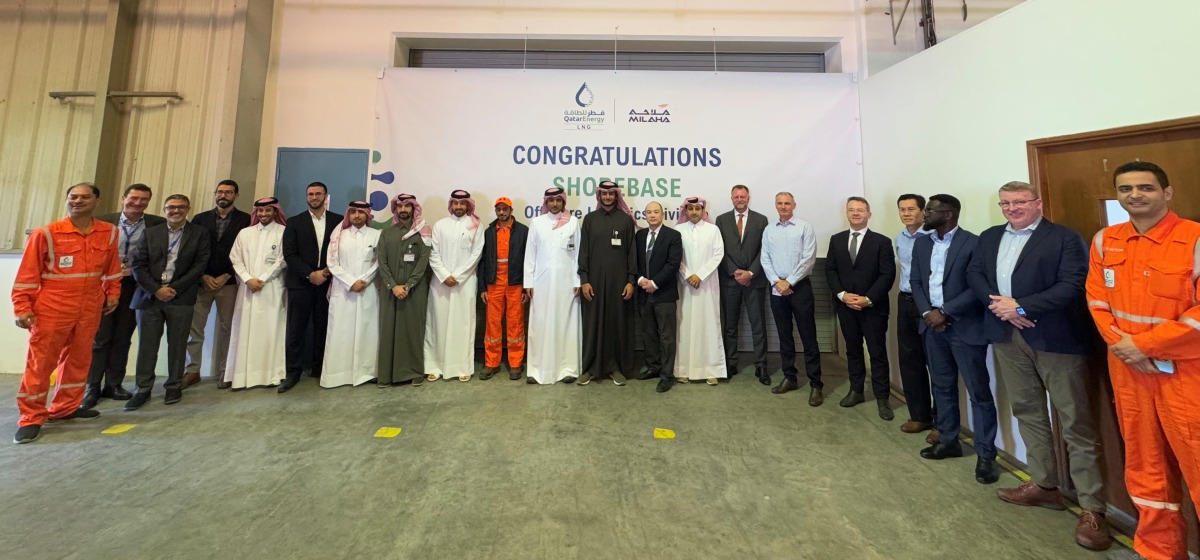 QatarEnergy LNG and Milaha officials pose for a group photo.