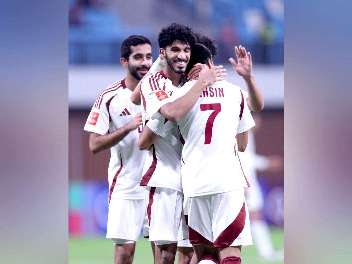 Qatar players celebrate a goal against Kyrgyzstan yesterday. 