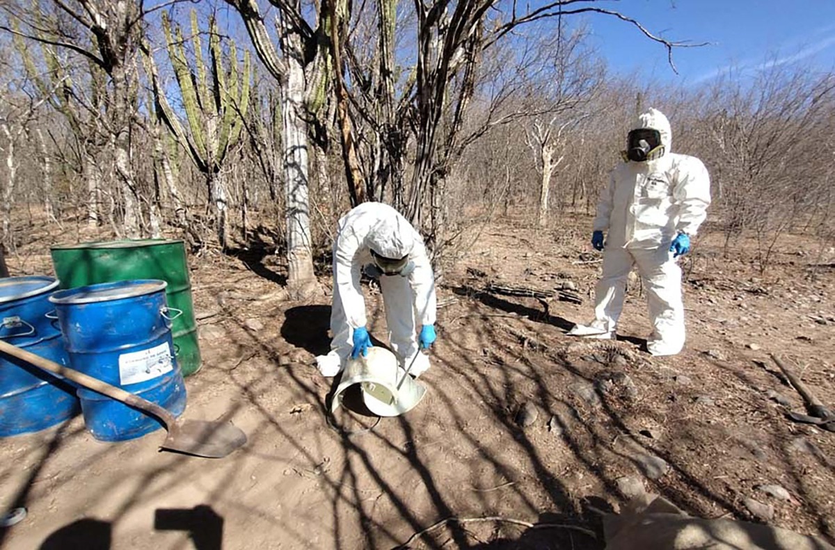 This handout picture released on February 17, 2025, by the Mexican Army shows Mexican soldiers dressed in biosecurity suits dismantling a drug production laboratory in Cosala, Sinaloa State, Mexico. (Photo by Handout / MEXICAN ARMY / AFP)