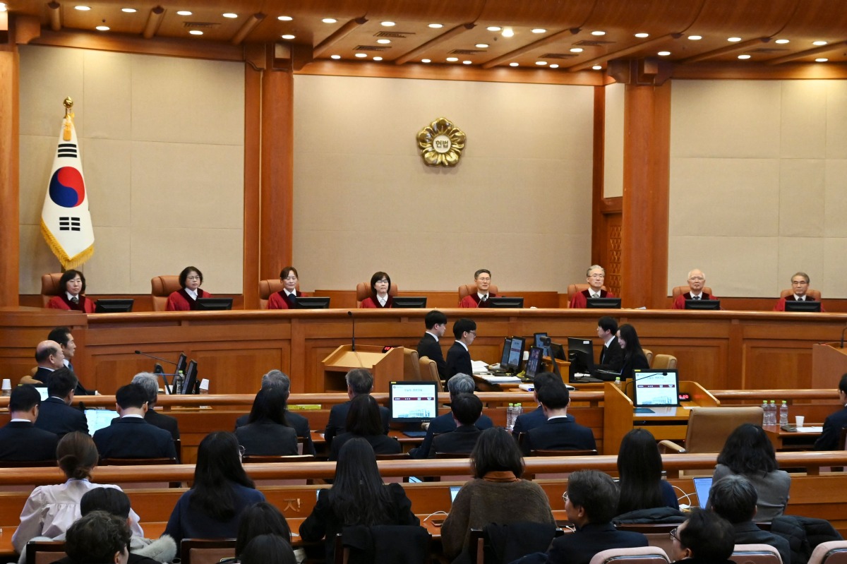 (L-R) The Constitutional Court of Korea's eight justices Chung Kye-sun, Kim Bok-hyeong, Jung Jung-mi, Lee Mi-son, Moon Hyung-bae, Kim Hyung-du, Cheong Hyung-sik and Cho Han-chang are seated in their courtroom for the trial of South Korea's impeached President Yoon Suk Yeol during the tenth hearing over his short-lived imposition of martial law at the Constitutional Court in Seoul on February 20, 2025. (Photo by SONG Kyung-Seok / POOL / AFP)