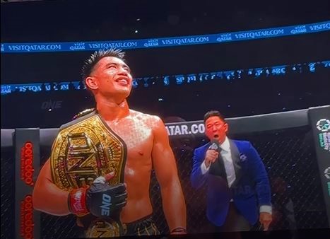 A screenshot of Philippines' Joshua Pacio after clinching the Strawweight MMA World Championship against USA’s Jarred Brooks at the ONE171:Qatar on February 20, 2025.