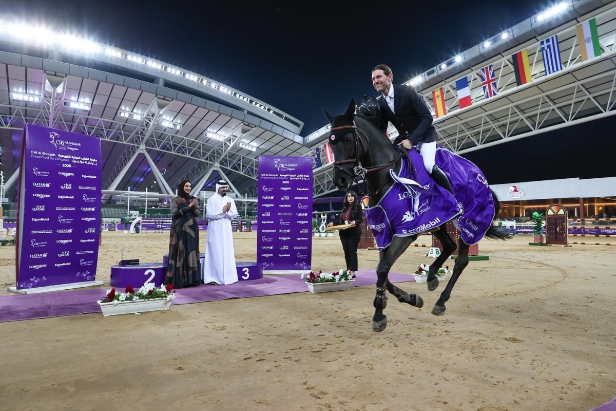 France's Simon Delestre celebrates after winning the CSI5* 1.50m on the opening day of CHI Al Shaqab 2025 at the Longines Outdoor Arena. The winners were crowned by CEO of Qommunication Dr. Noura Bouhalika.