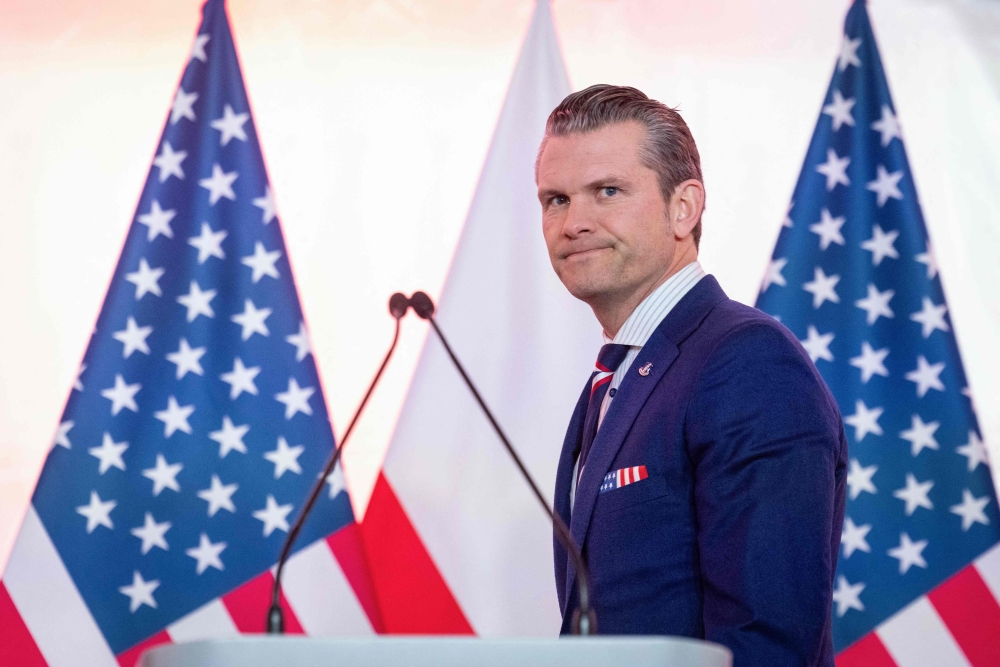 (Files) US Defence Secretary Pete Hegseth arrives for a press conference at the Ministry of Defence headquarters in Warsaw on February 14, 2025. (Photo by Wojtek Radwanski / AFP)
 