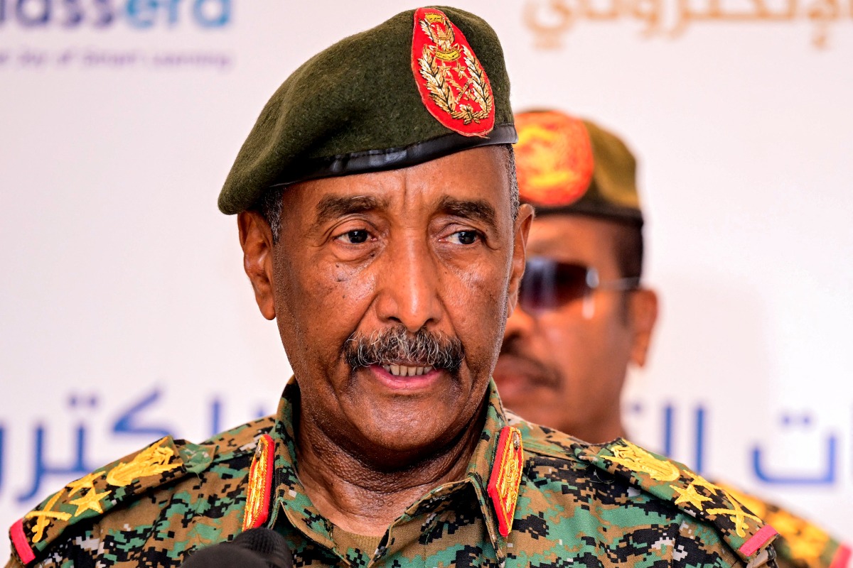 Sudan's army chief General Abdel Fattah Al-Burhan addresses the conference to support initiatives for e-learning projects and the enrichment of education infrastructure in the Darfur region and the launch of smart education platforms, in Port Sudan on February 17, 2025. (Photo by AFP)