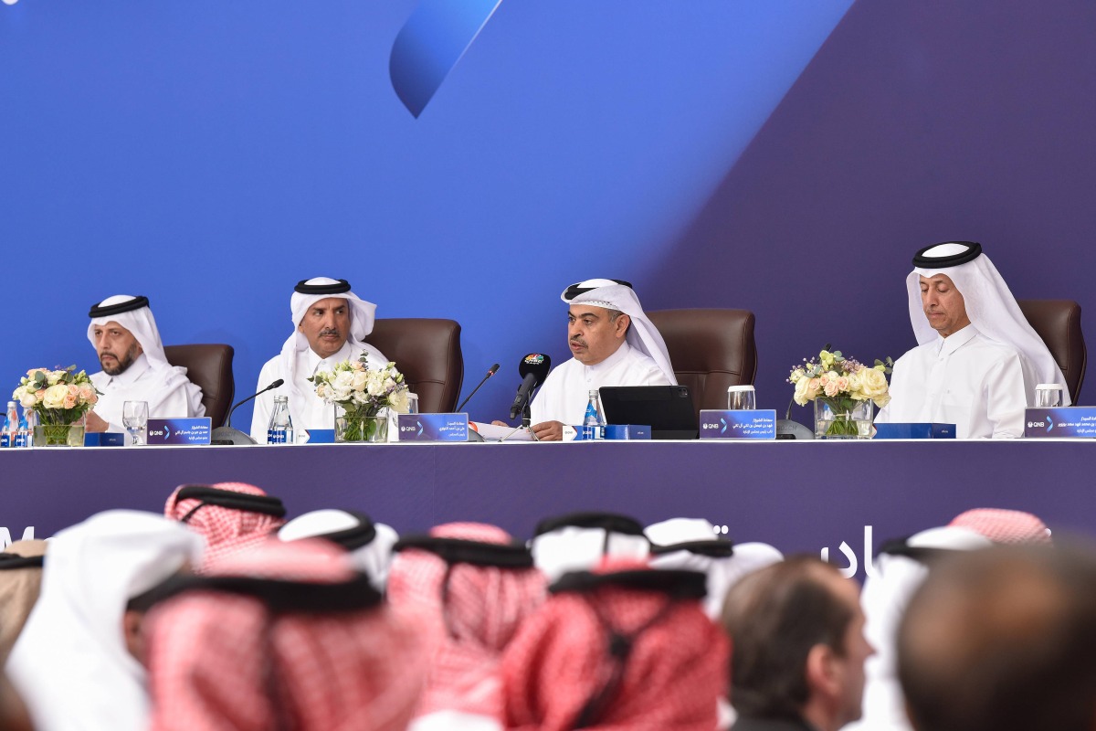 Chairman of QNB Group’s Board of Directors H E Ali Ahmed Al Kuwari with board members during the Extraordinary and Ordinary General Assembly Meeting, yesterday.