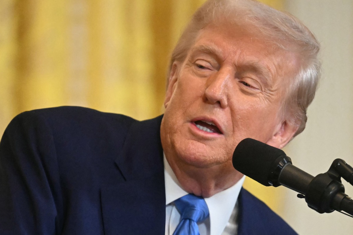 US President Donald Trump speaks during a joint press conference with French President Emmanuel Macron in the East Room to the White House in Washington, DC, on February 24, 2025. (Photo by Jim WATSON / AFP)
