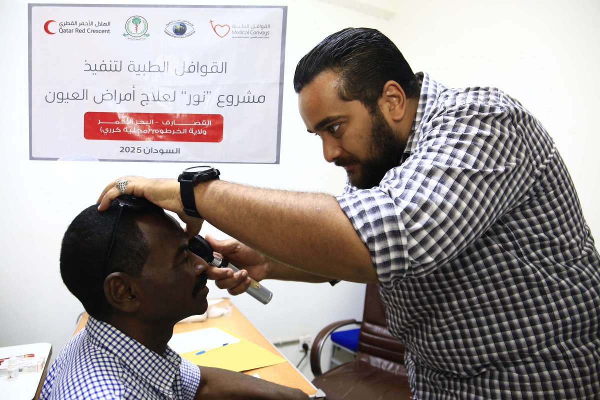 A medical practitioner attends to one of the patients.