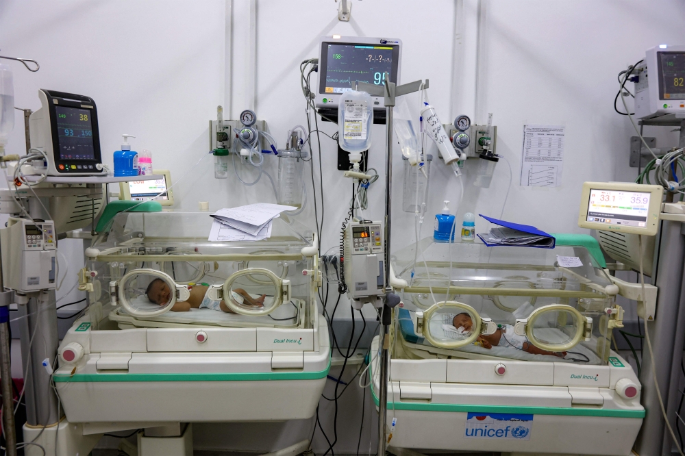 Prematurely-born infants lie in incubators at the neonatal intensive care unit (NICU) at the Patient Friend's Benevolent Society hospital in Gaza City on February 25, 2025. (Photo by Omar Al-Qattaa / AFP)