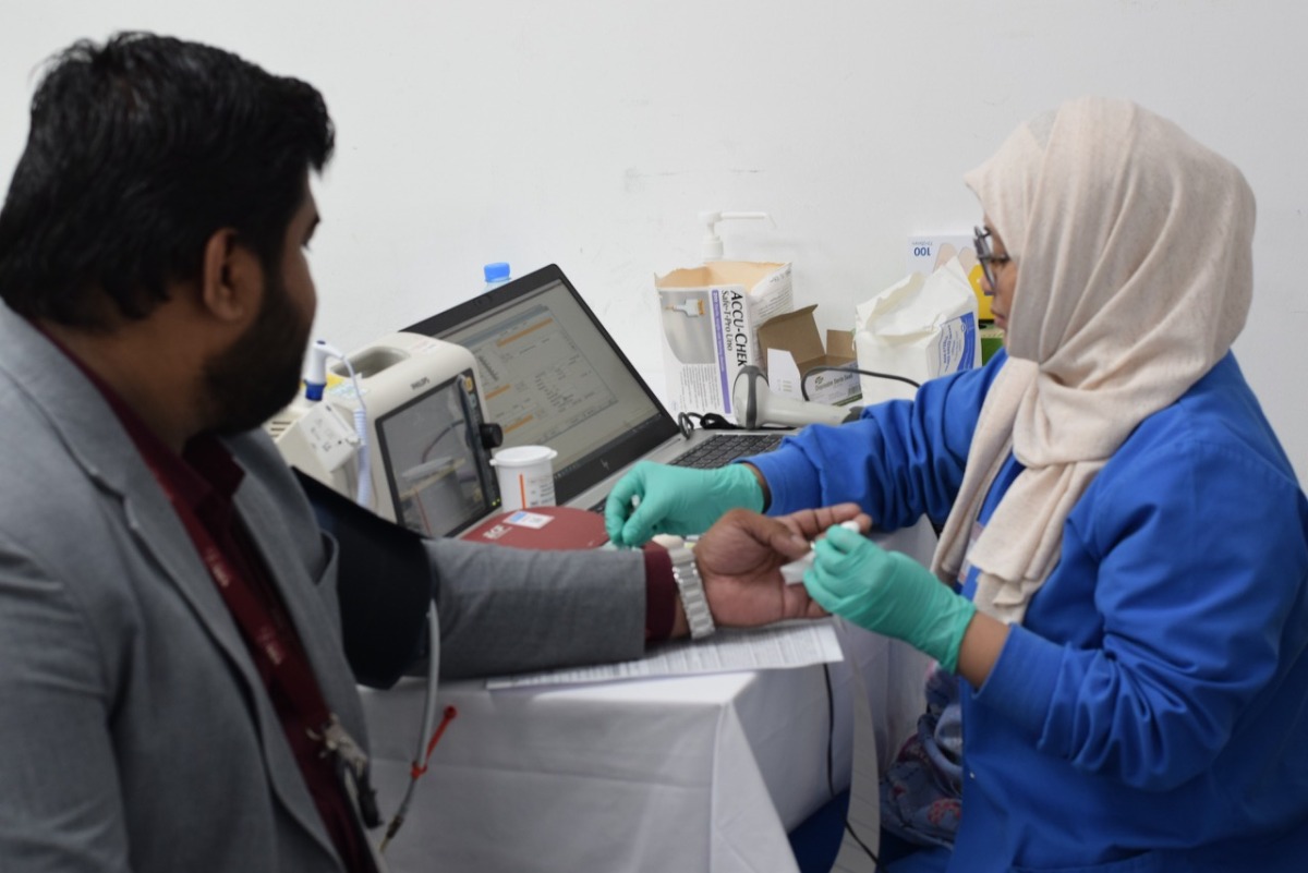 A staff member donates blood during the campaign recently.