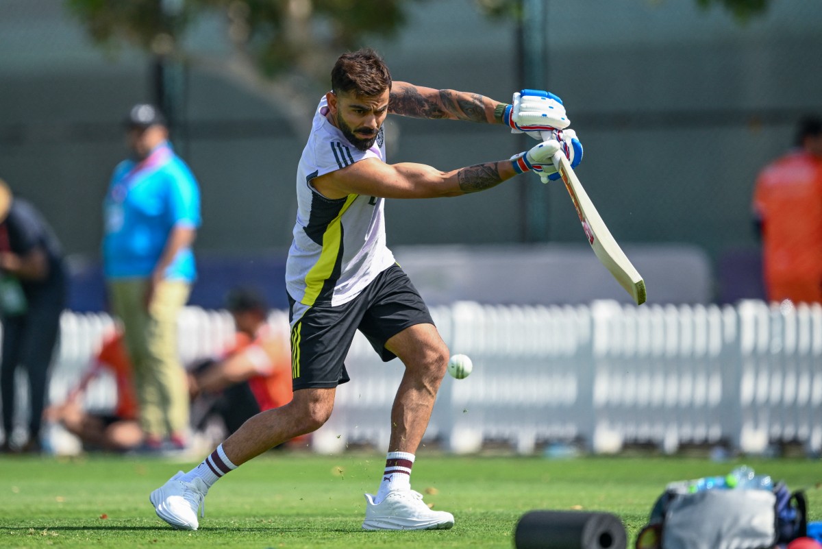 India's Virat Kohli plays a shot during a practice session at the ICC Academy ground in Dubai on February 22, 2025. (Photo by Jewel SAMAD / AFP)
