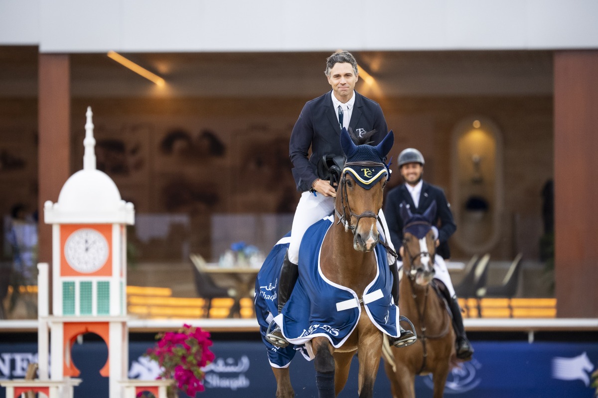 South Africa's Oliver Lazarus astride Butterfly Ennemmel celebrates his win in CSI3* 1.45m class.