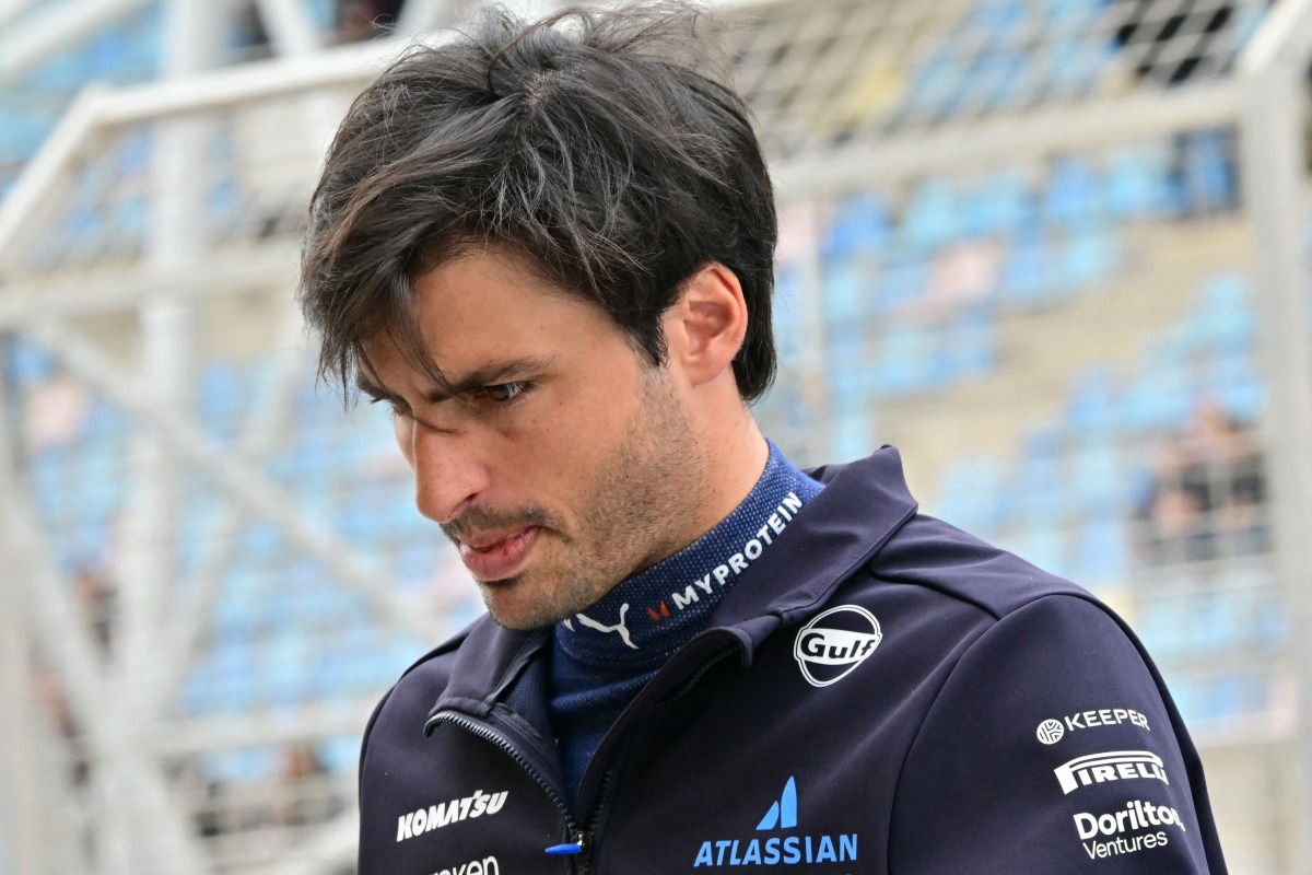 Williams' Spanish driver Carlos Sainz walks in the pits on the second day of the Formula One pre-season testing at the Bahrain International Circuit in Sakhir on February 27, 2025. (Photo by Giuseppe CACACE / AFP)