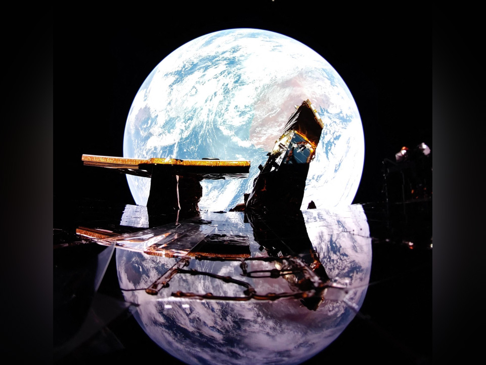 This undated image released by Firefly Aerospace Blue Ghost captures Earth reflecting off the solar panel with the Moon on the horizon. (Photo by Handout / Firefly Aerospace / AFP) 