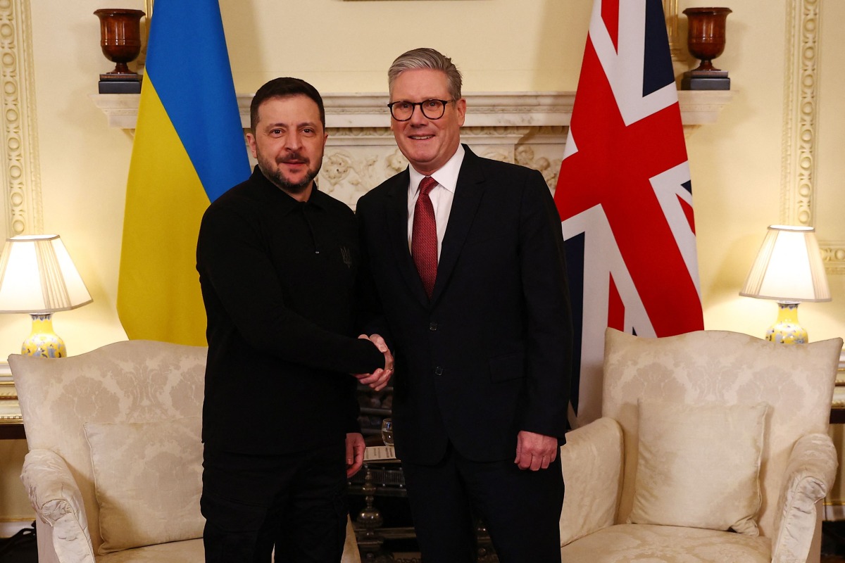 Britain's Prime Minister Keir Starmer shakes hands with Ukraine's President Volodymyr Zelensky during a bilateral meeting in central London on March 1, 2025 ahead of a European leader's summit the following day. (Photo by Peter Nicholls / POOL / AFP)
