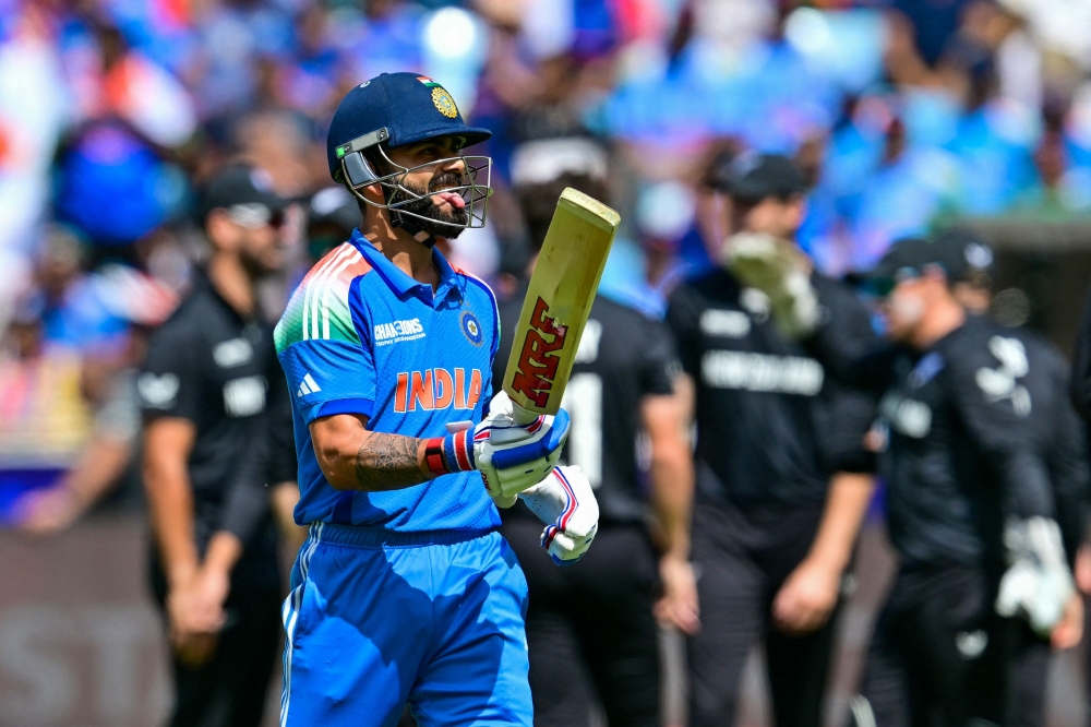 India's Virat Kohli reacts as he leaves the field after being caught out during the ICC Champions Trophy one-day international (ODI) cricket on March 2, 2025. (Photo by Giuseppe CACACE / AFP)