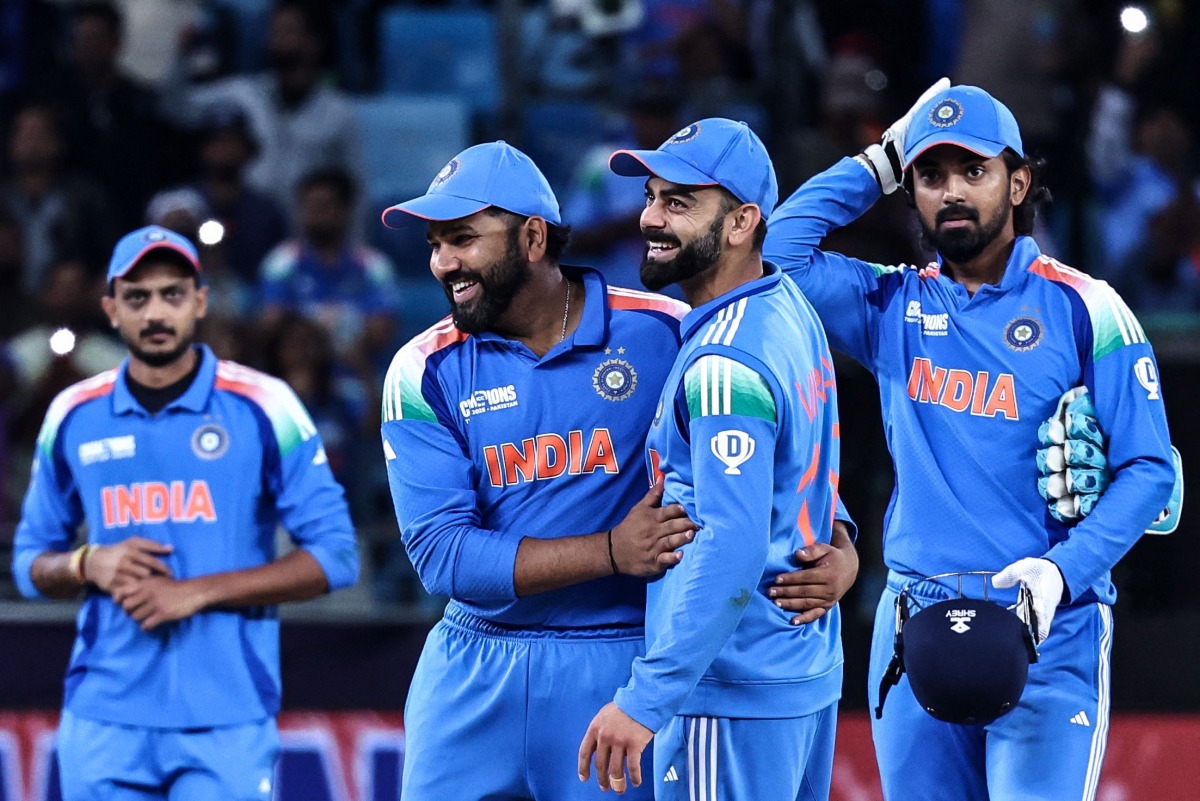 India's captain Rohit Sharma (2L) and his teammate Virat Kohli (2R) celebrate their team's win in the ICC Champions Trophy one-day international (ODI) cricket match between New Zealand and India at the Dubai International Stadium in Dubai on March 2, 2025. (Photo by FADEL SENNA / AFP)