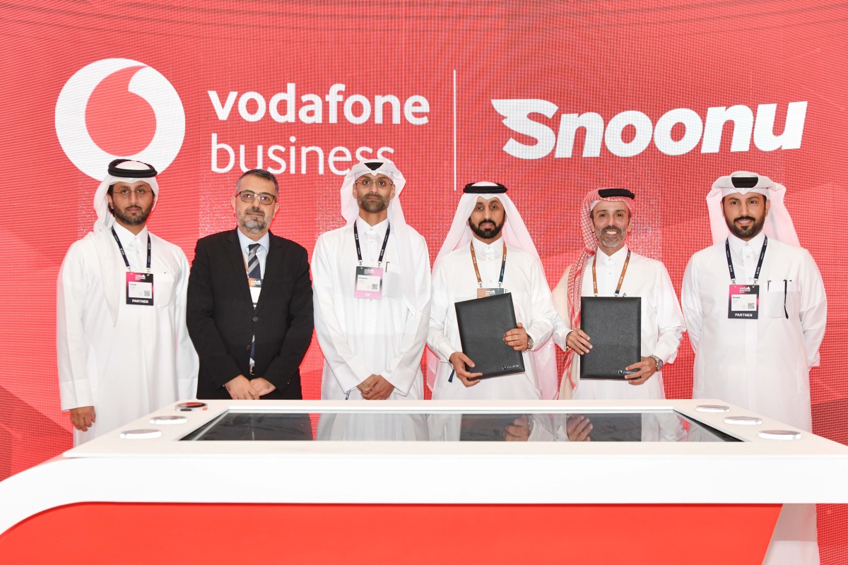 Acting EBU Director at Vodafone Qatar, Mohamed Mohsin Alyafei and Founder and CEO at Snoonu, Hamad Alhajri with other officials during the signing ceremony.