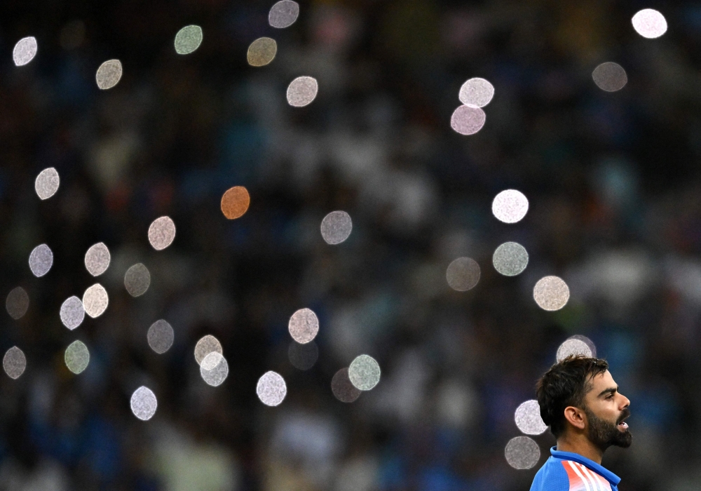 India's Virat Kohli takes a break during the ICC Champions Trophy one-day international (ODI) semi-final cricket match between Australia and India at the Dubai International Stadium in Dubai on March 4, 2025. (Photo by Ryan Lim / AFP)