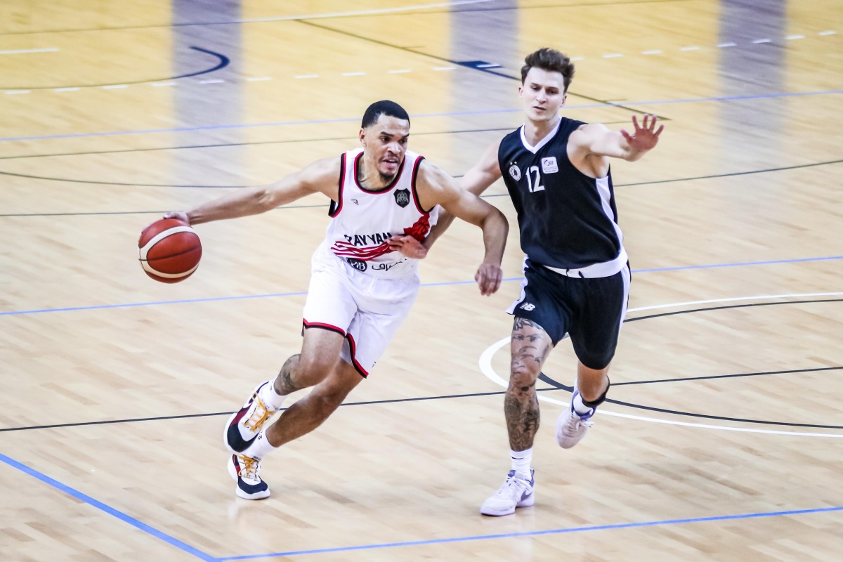 Al Rayyan’s Tyler James Lee Harris (left) dribbles while an Al Sadd player attempts to defend. 