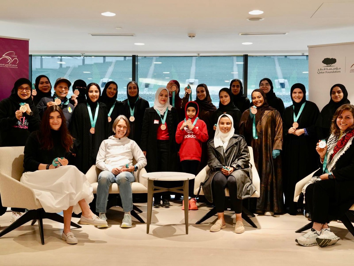 Qatar women’s cycling team coach Noura Al Amiri and officials with the award winners of the Cycle Her Way programme.