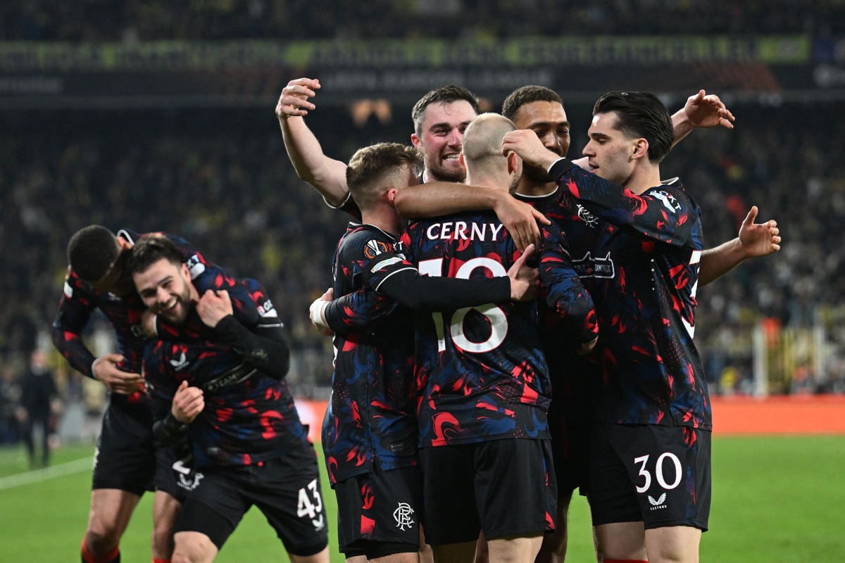 Rangers’ Czech midfielder #18 Vaclav Cerny (C) celebrates with teammates after scoring a goal during the UEFA Europa League round of 16 first-leg football match between Fenerbahce SK and Rangers FC (Glasgow Rangers) at the Sukru Saracoglu Stadium in Istanbul on March 6, 2025. (Photo by Ozan KOSE / AFP)
