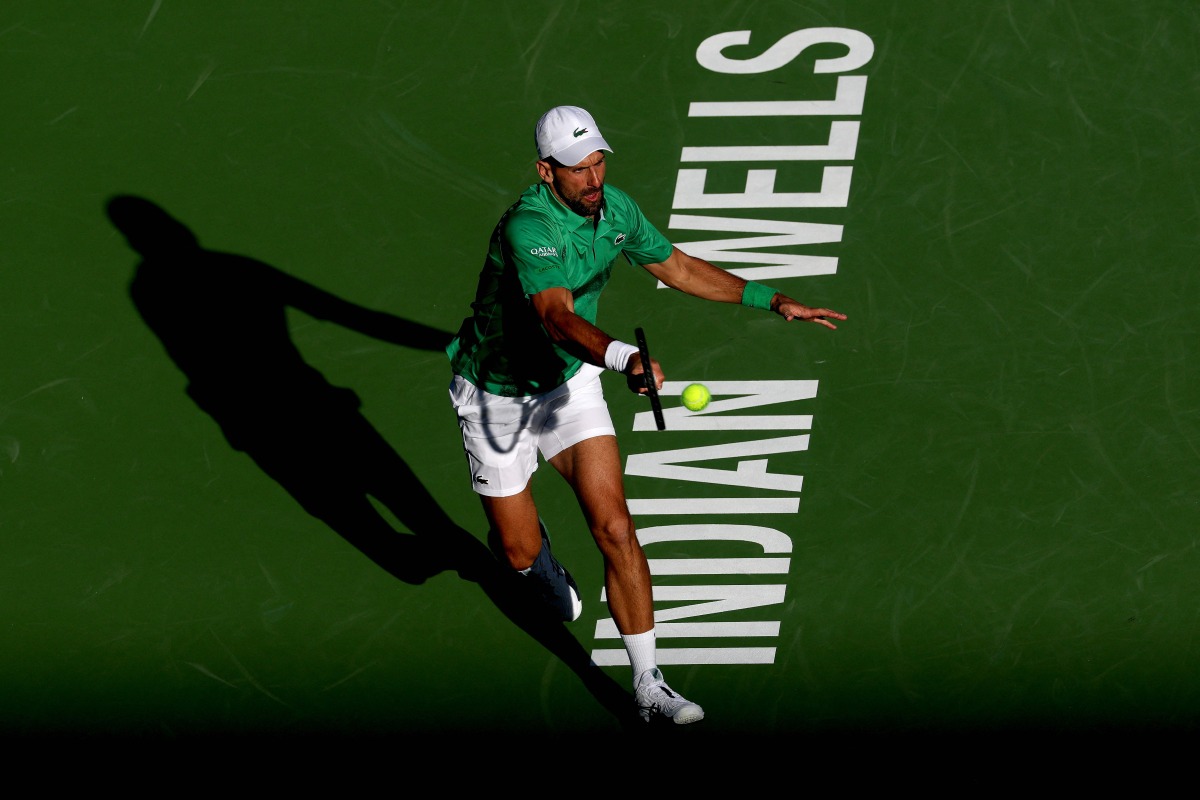 Novak Djokovic of Serbia returns a shot to Botic van de Zandschulp Netherlands during the BNP Paribas Open at Indian Wells Tennis Garden on March 08, 2025 in Indian Wells, California. Matthew Stockman/Getty Images/AFP