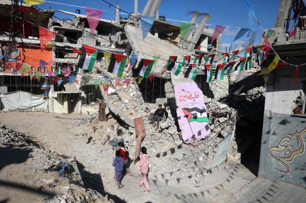 Palestinians decorated their war-devastated neighbourhood to welcome Ramadan. Photo by AFP