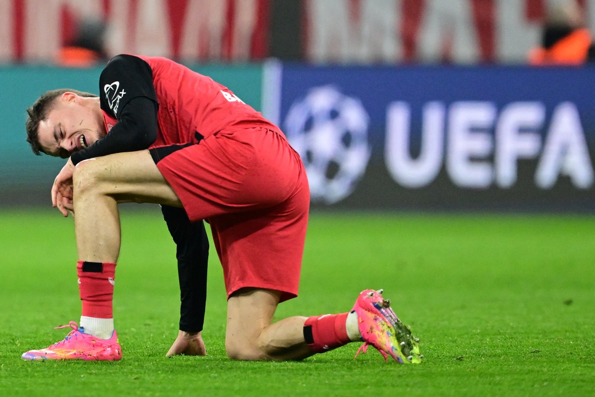 Bayer Leverkusen's German midfielder #10 Florian Wirtz reacts during the UEFA Champions League last 16, first-leg, football match FC Bayern Munich v Bayer 04 Leverkusen on March 5, 2025 in Munich, southern Germany. (Photo by Tobias SCHWARZ / AFP)
