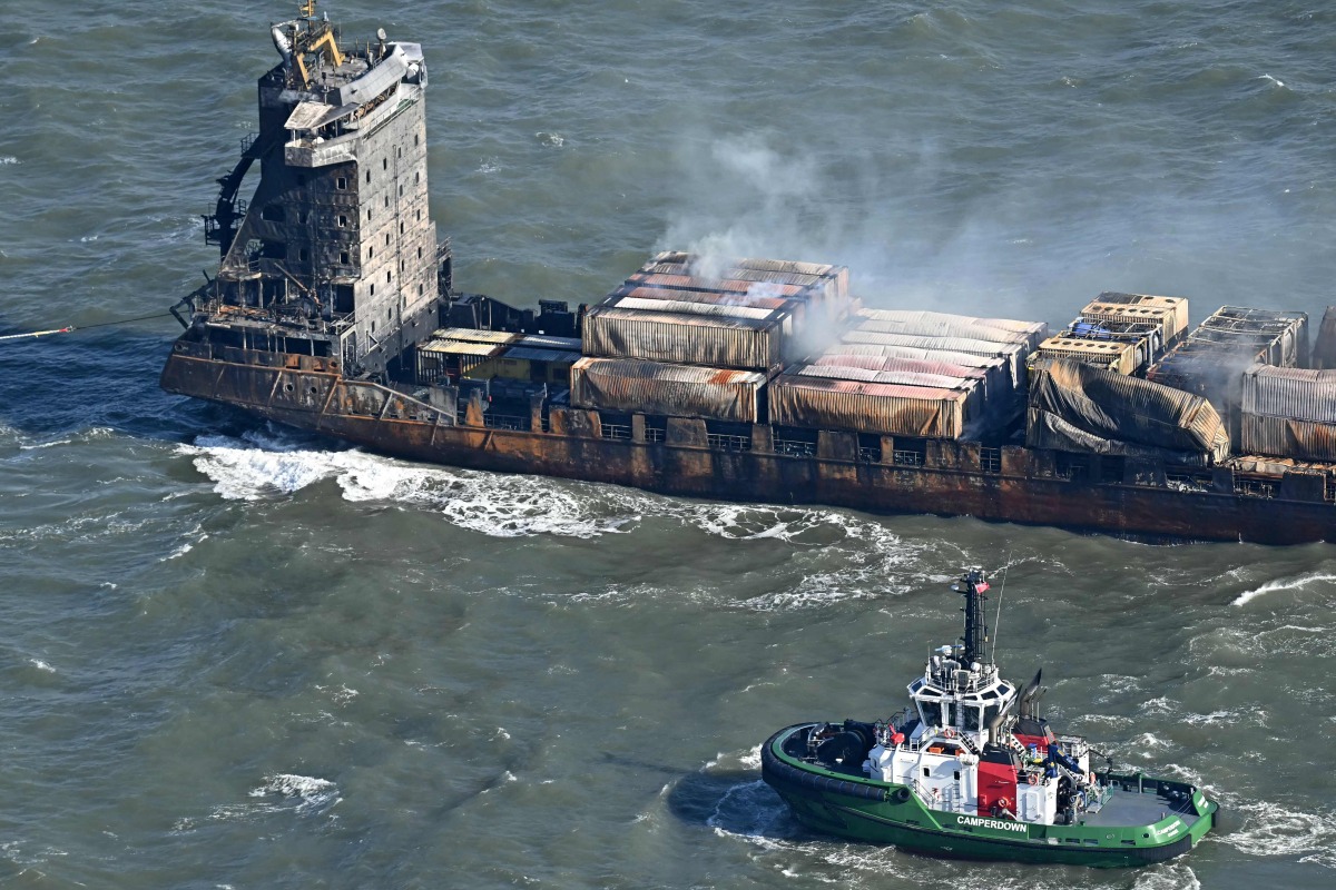 Smoke rises from damaged containers on the deck of the MV Solong cargo ship in the North Sea, off the coast of Withernsea, east of England, on March 11, 2025, after it collided with the MV Stena Immaculate tanker on March 10. Photo by Paul ELLIS / AFP