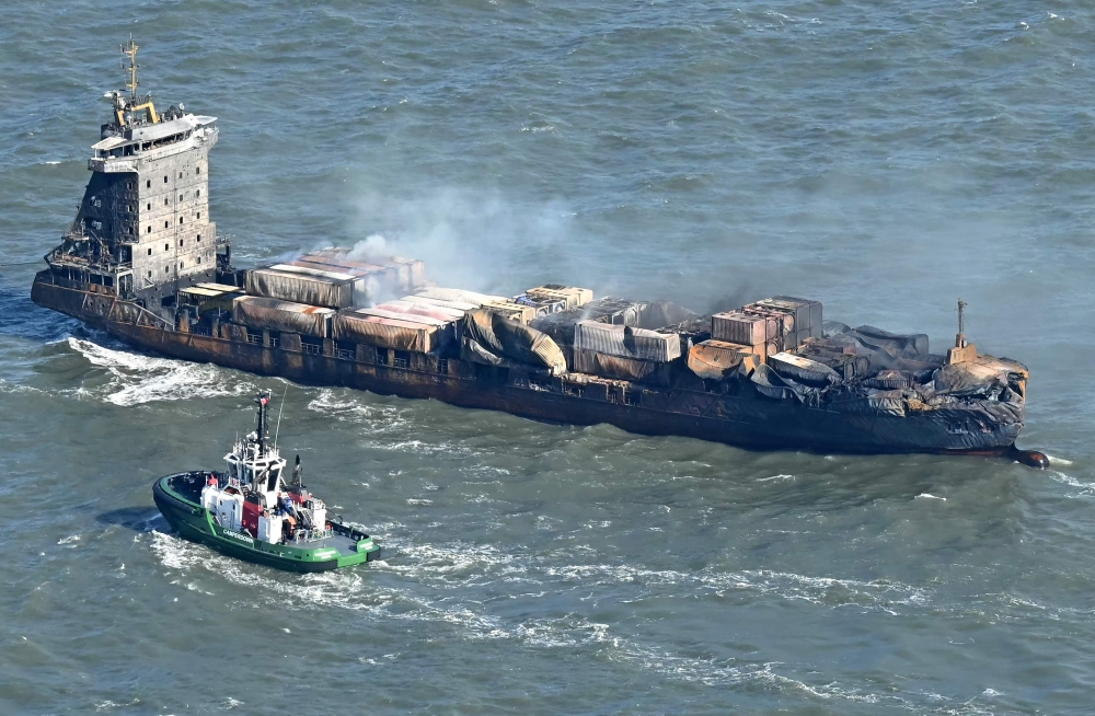 Smoke rises from the MV Solong cargo ship in the North Sea, off the coast of Withernsea, east of England, on March 11, 2025. (Photo by Paul Ellis / AFP)