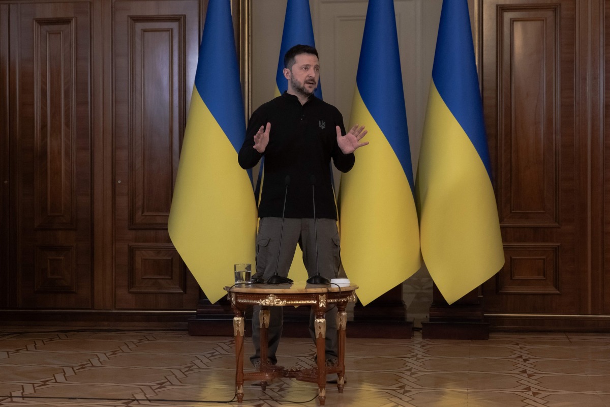 Ukraine's President Volodymyr Zelensky speaks to the media during a press conference in Kyiv on March 12, 2025, amid the Russian invasion of Ukraine. (Photo by Roman PILIPEY / AFP)
