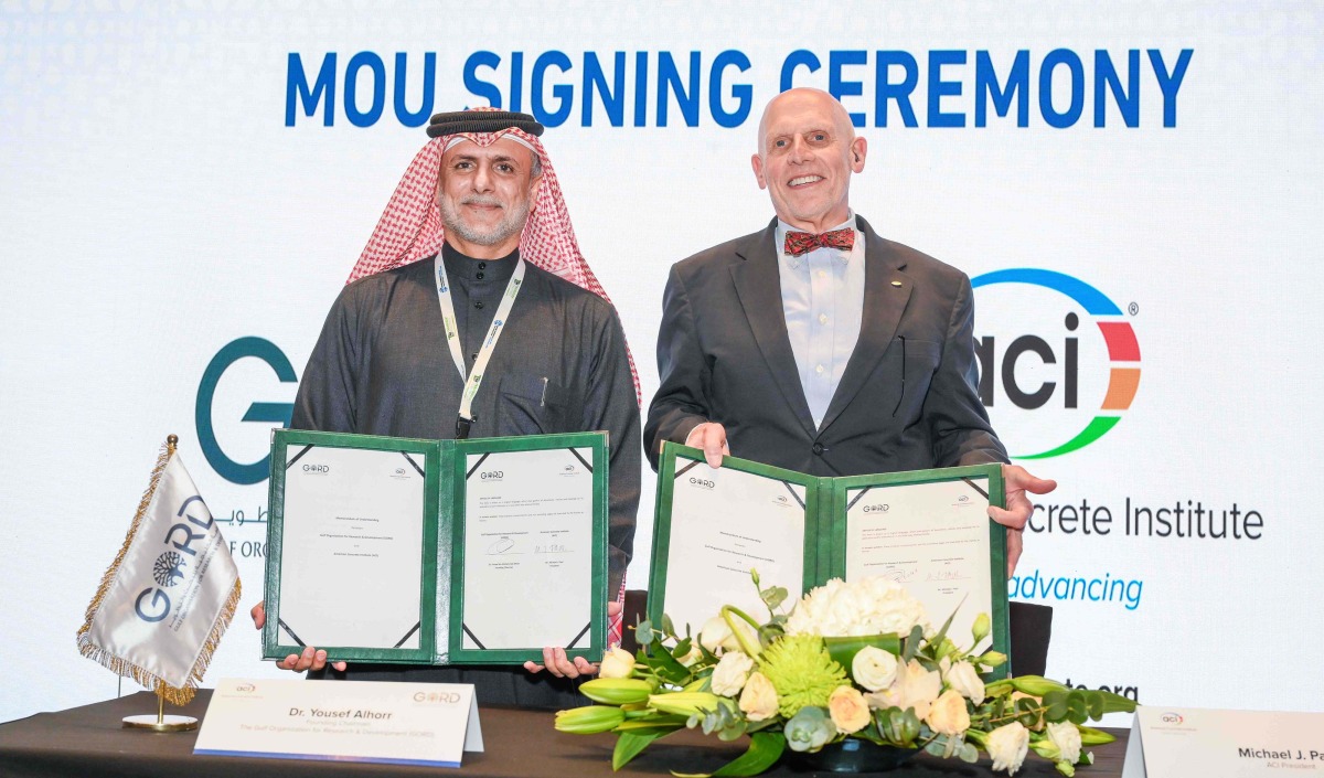 Founding Chairman of GORD Dr. Yousef Alhorr (left) and President of ACI Michael J. Paul exchanging documents after signing the agreement.