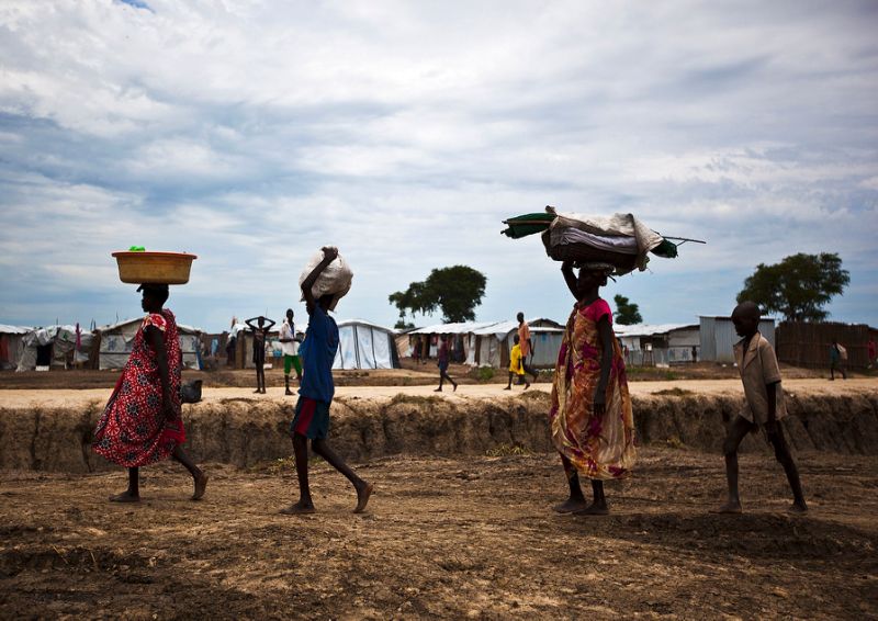 People walk through the UN base outside Bentiu, South Sudan, September 17, 2015. AFP, Tristan McConnell