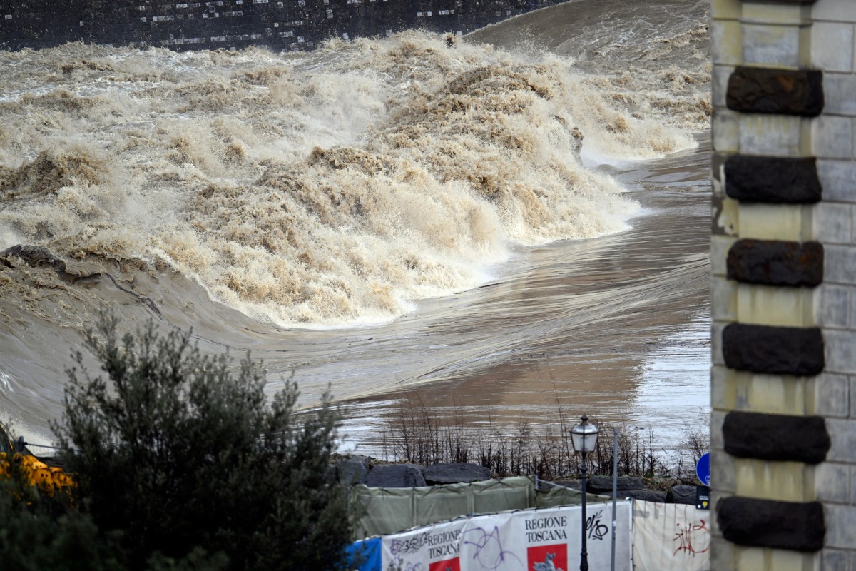 A picture shows the high level of the Arno river in Florence during floods in Tuscany, on March 14, 2025. Photo by Claudio GIOVANNINI / ANSA / AFP