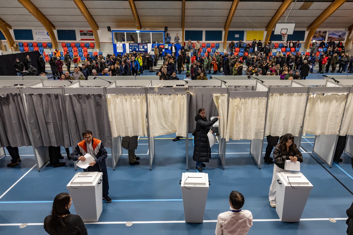 Photo used for representational purposes. Greenlanders queue to vote at the sports hall in Nuuk, Greenland, on March 11, 2025, on the day of Greenland, the autonomous Danish territory legislative elections. Photo by Odd ANDERSEN / AFP.