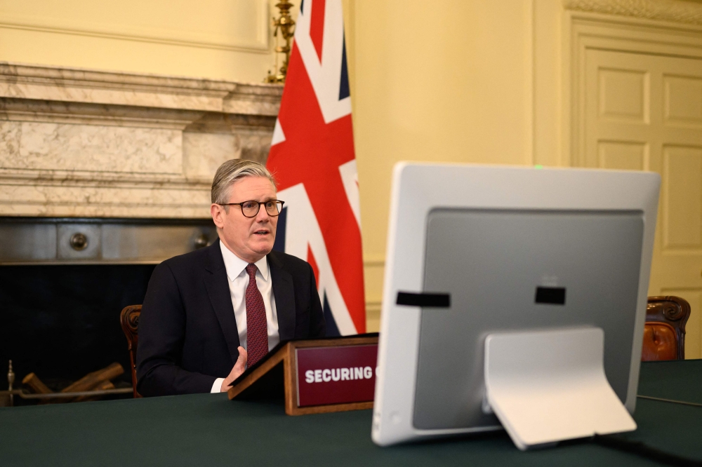 Britain's Prime Minister Keir Starmer hosts a virtual meeting with international leaders to discuss support for Ukraine inside 10 Downing street in central London on March 15, 2025. (Photo by Leon Neal / POOL / AFP)