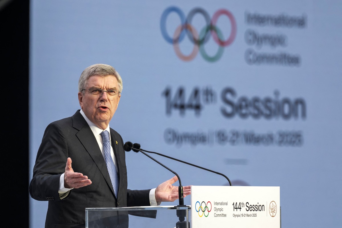 Outgoing International Olympic Committee (IOC) President Thomas Bach delivers a speach during the Opening ceremony of the 144th IOC Session at the Ancient Olympia archeological site, birthplace of the ancient Olympics in southern Greece, on March 18, 2025. (Photo by Fabrice COFFRINI / AFP)