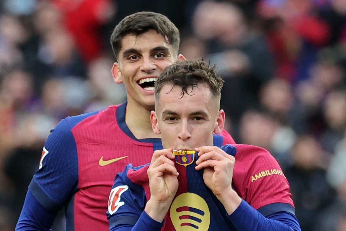 Barcelona's Spanish midfielder #17 Marc Casado (R) celebrates scoring his team's second goal next to Barcelona's Spanish defender #35 Gerard Martin during the Spanish league football match between FC Barcelona and Real Sociedad at Estadi Olimpic Lluis Companys in Barcelona on March 2, 2025. (Photo by LLUIS GENE / AFP)
