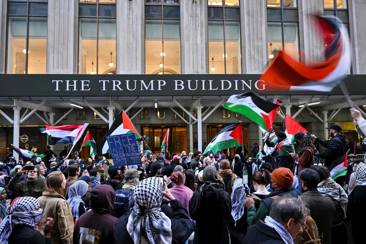 (FILES) People protest during a pro-Palestinian demonstration at the Trump Building in New York on March 19, 2025. (Photo by ANGELA WEISS / AFP)
