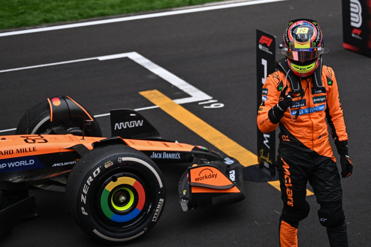 McLaren's Australian driver Oscar Piastri celebrates winning the Formula One Chinese Grand Prix at the Shanghai International Circuit in Shanghai on March 23, 2025. (Photo by Jade GAO / AFP)